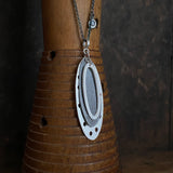 Foramina Pendant with Dot Charm