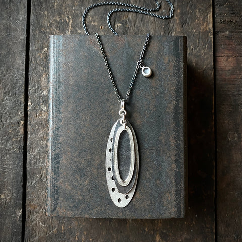 Foramina Pendant with Dot Charm