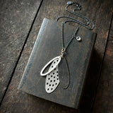 Foramina Pendant with Dot Charm