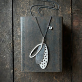 Foramina Pendant with Dot Charm